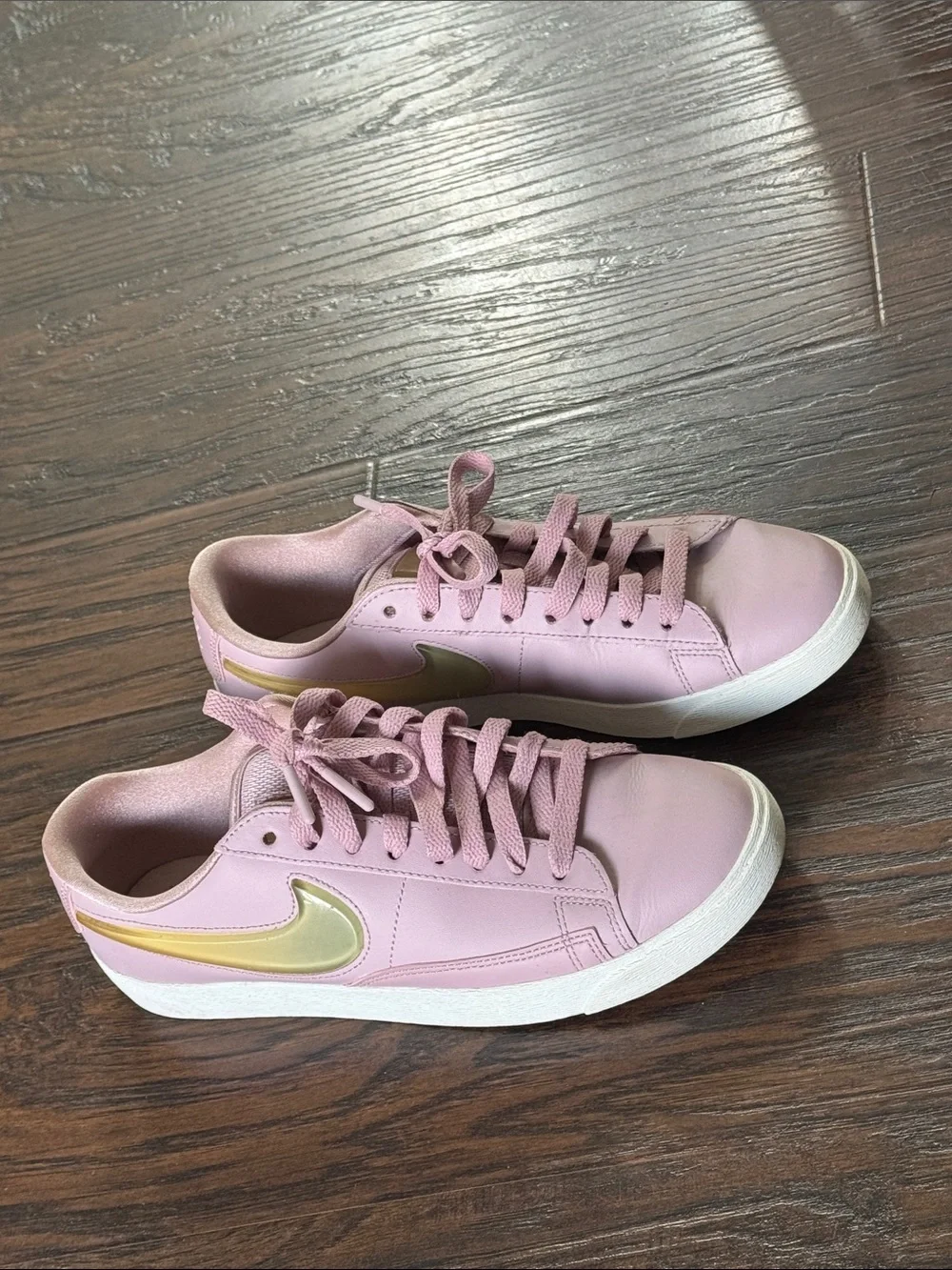 Nike Women's Blush Pink Low-Top Leather Sneakers with Metallic Gold Swoosh